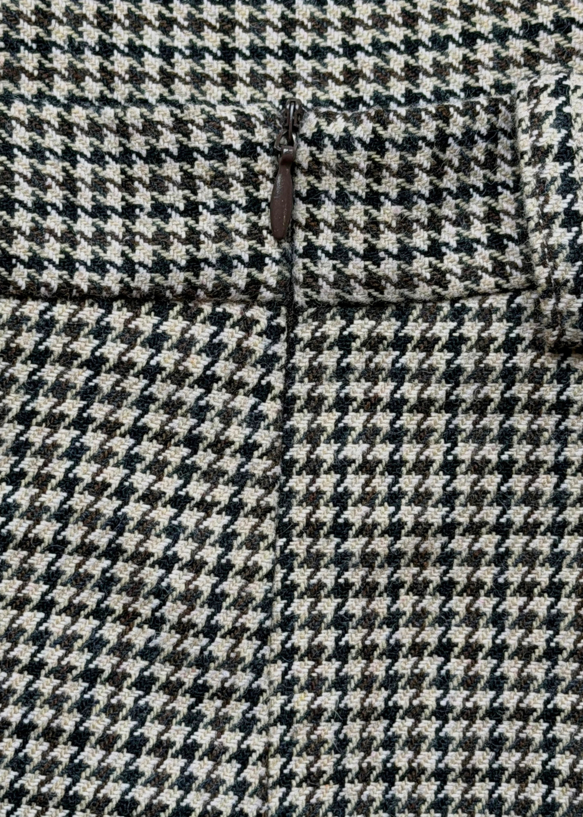 Close-up of the concealed side zip on the Brock houndstooth shorts